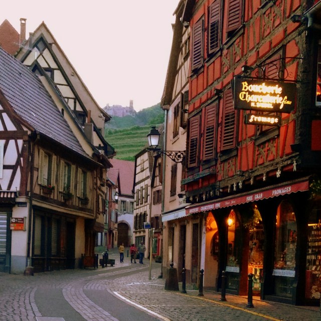 Standing in the middle of Ribeauville's Grand Rue. See the castle on the hill above?